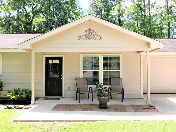 This is what memories are made of... morning coffee on your front porch and watching the kids ride scooters on your double-wide & extra long driveway. Notice the hardi-siding for long life and easy maintenance.