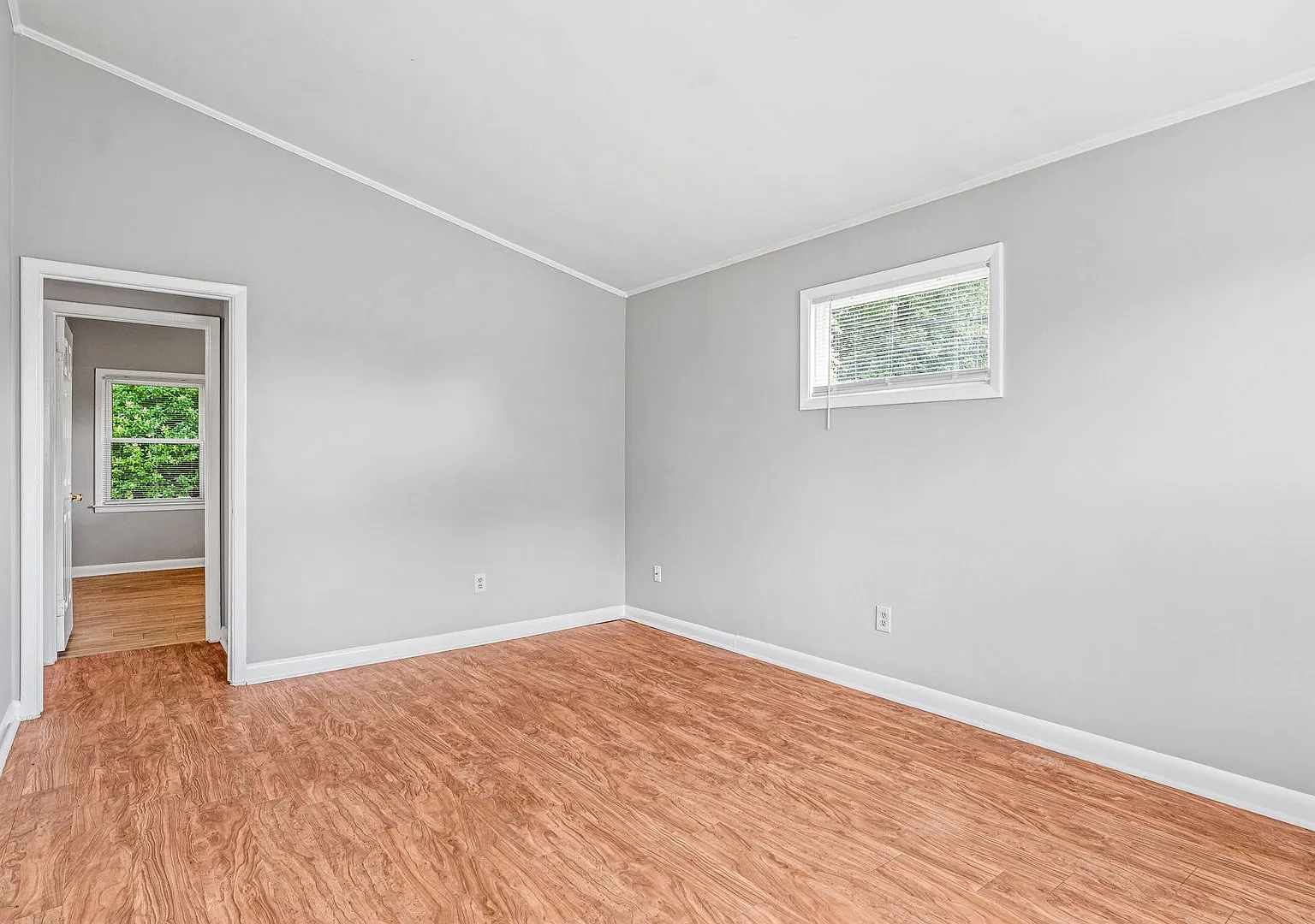 NE Desirable Neighborhood, Brick Home, Wood/Laminate Flooring, Vaulted Ceilings, Carport, Fenced! — Photo 4