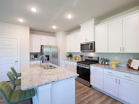 The Lennon floorplan modeled at Village at White Pine.