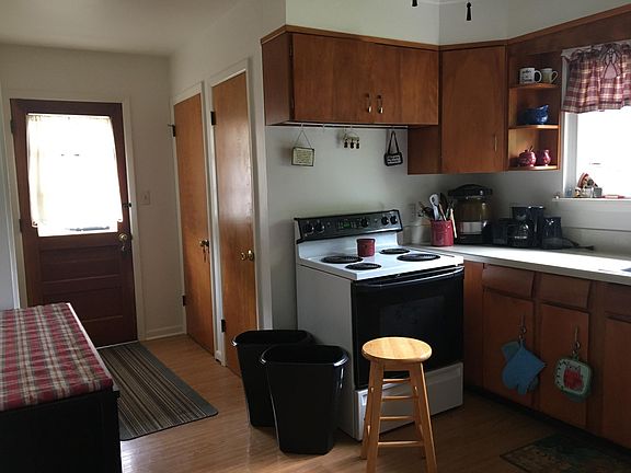 Kitchen view 1 looking toward side door (note:personal items do not convey inlcuding shelf on left)