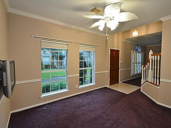 Entry to the home you are greeted by a spacious formal dining room open to the foyer.