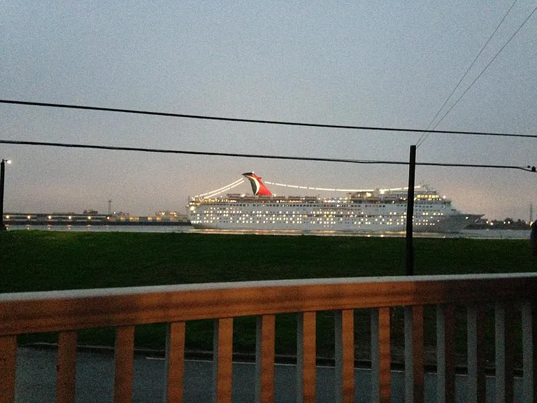 cruise boat going by in front of house