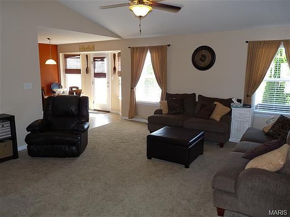 Spacious vaulted great room is open to breakfast room and kitchen.