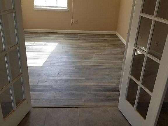 New wood laminate floors in all bedrooms, NO CARPET in entire home.