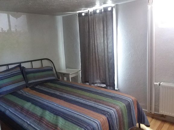 Thick, privacy curtains on large window well/ fire escape.