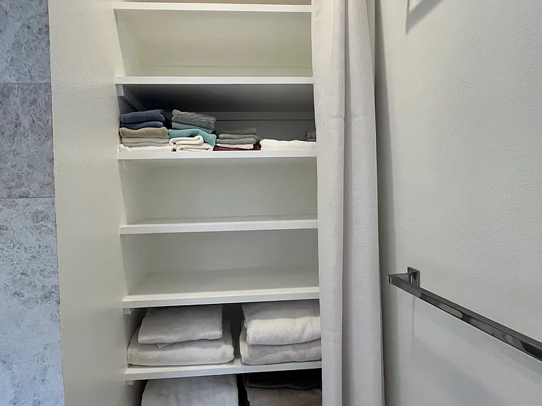 Master bathroom towel closet