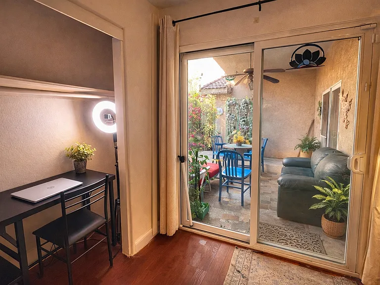 Entrance to the yard with large covered patio