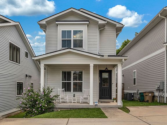 Front Exterior - two parking spaces in driveway in front of house.