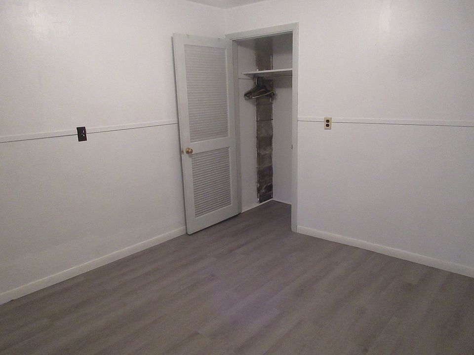 closet in corner of one bedroom