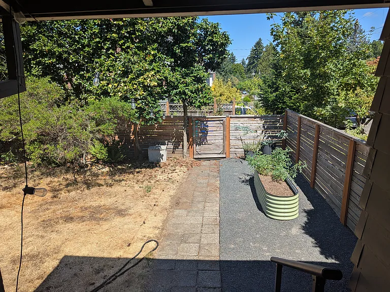 Summers in this backyard are a must, we do movie night with a projector. New fence put in a year ago, and raised bed is ready to be filled!