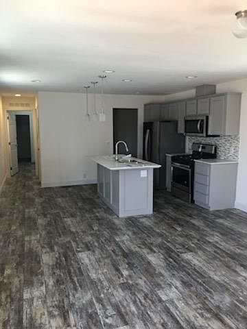 Open Concept kitchen/living room. Granite counter tops with real wood cabinets!