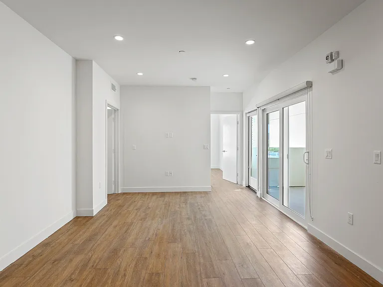 Living Room with Vinyl Flooring, Recessed Lighting, and Patio