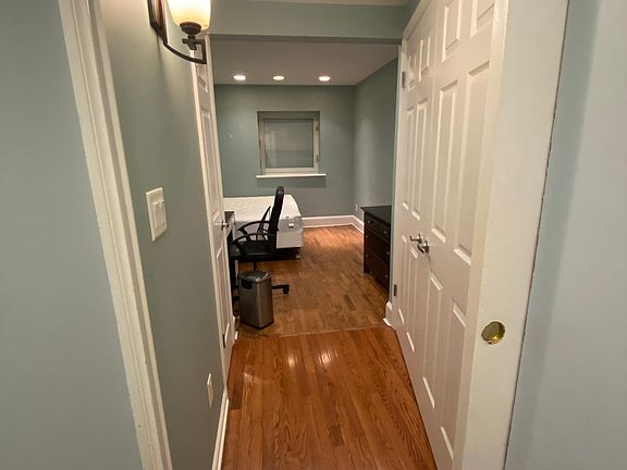 Entry way to bedroom with sliding door for privacy