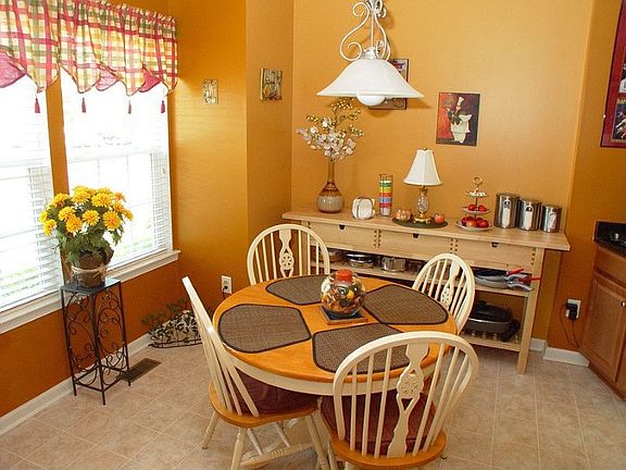 Kitchen dining area with double windows for plenty of natural light.