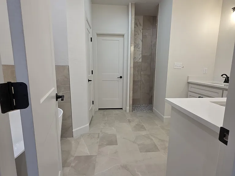 Primary/Master Bathroom with easy care tile floors