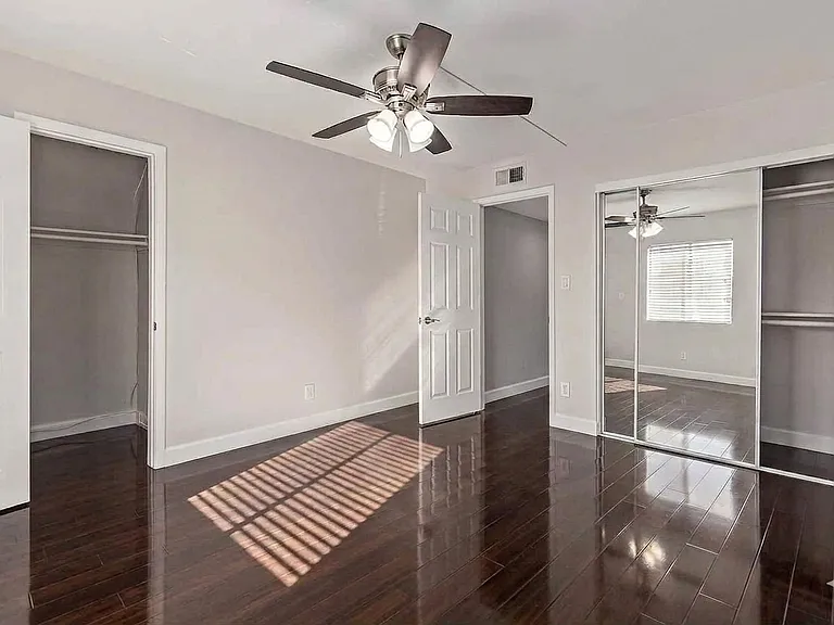Bedroom showing both closets and no furniture