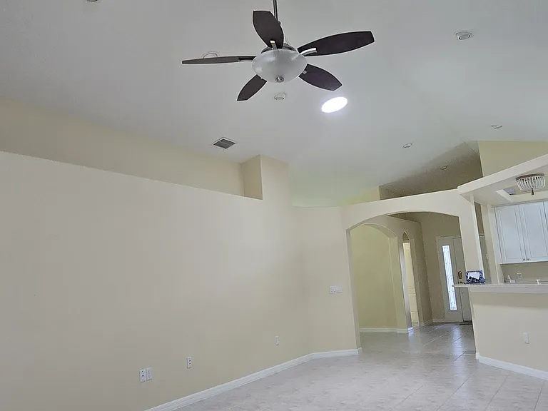 Living Room with two Solar Tubes and High Hats