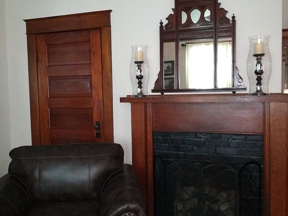 Beautiful original woodwork in living room and gas log fireplace for those cozy evenings.