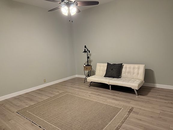 2520 West Franklin Living room. New flooring, ceiling fan, new front door