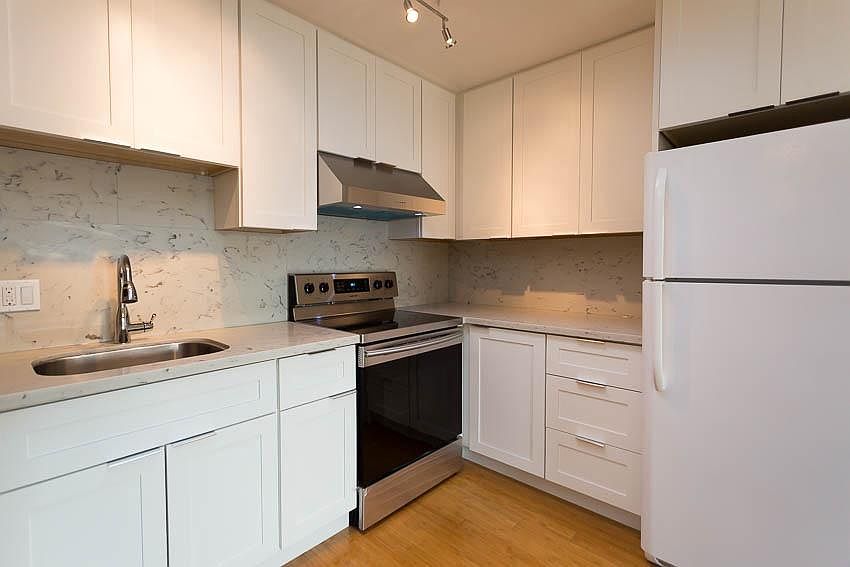 Newly Remodeled Kitchen with Carrara Counters/Backsplash