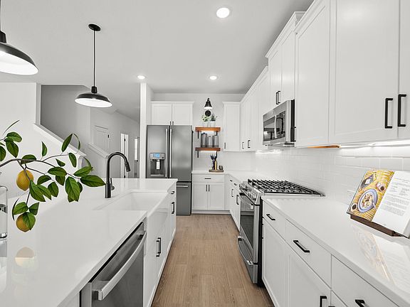 Kitchen with white quartz countertops