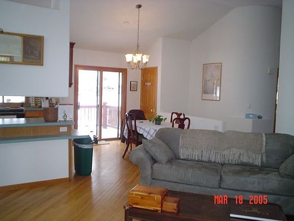 Living/dining - open floor plan, curved walls, vaulted ceiling