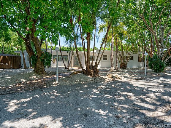 Exterior Front of house in oversize lot with lots of matured trees, privacy, and parking 