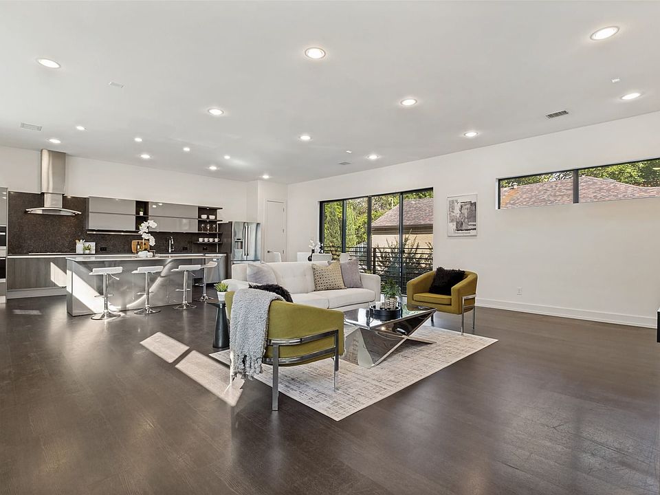 This modern open concept is both visually and functionally impressive! With main floor open concept living, all gathering spaces flow seamlessy and are accessible, making both entertaining and every day living convenient and