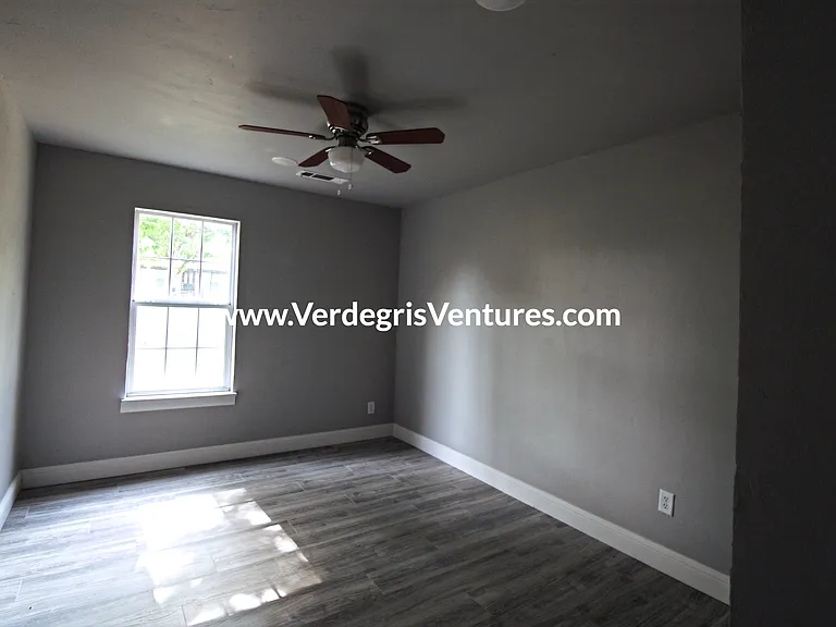 Bedroom 3: guest bedroom offers abundant natural light, a comfortable closet, and a ceiling fan.