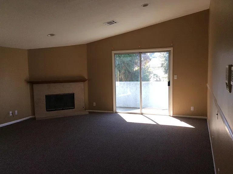 Upstairs Master bedroom with fireplace and private balcony.