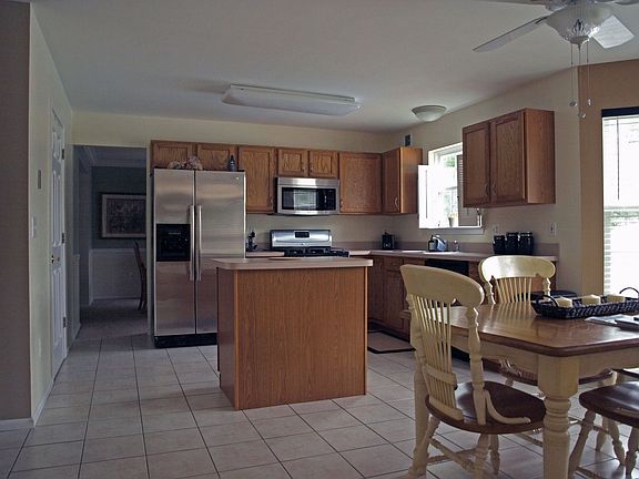 New stainless steel appliances in eat-in-kitchen