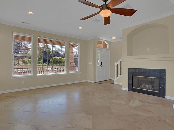 Family Room with Travertine Tile Floors, New Paint, and Gas Fireplace