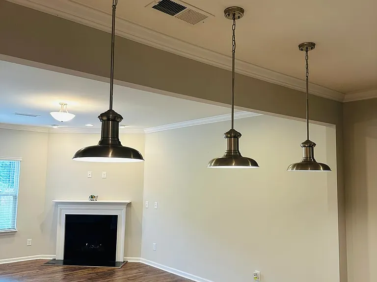 Bar lights in kitchen and fireplace in the hall