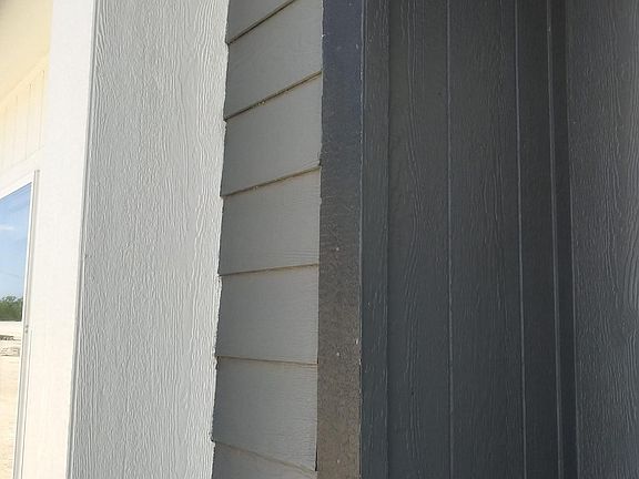 Recessed entrance and  accented with elegance not to mention security lights.