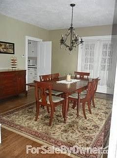 Dining Room : Built-in hutch (not showcased in this picture). French doors lead to sun porch.