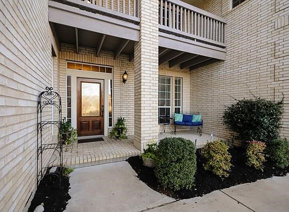 Front porch allows for enjoying the sunrise or watching children as they play in the quiet cul-de-sac.