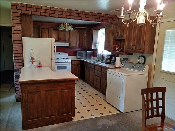 All kitchen appliances convey.  Dryer located in kitchen, washer located in the partial basement.