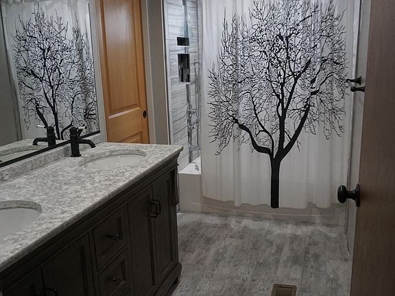 Master bathroom, toilet is on other side of pocket door.