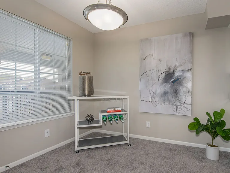 Enjoy meals in a charming dining room adjacent to the kitchen with views of the adjacent living area.