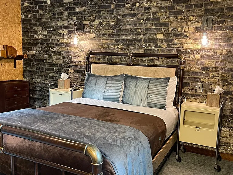 Brickhouse Suite Queen Bed with Dimmable Lights & Side Tables