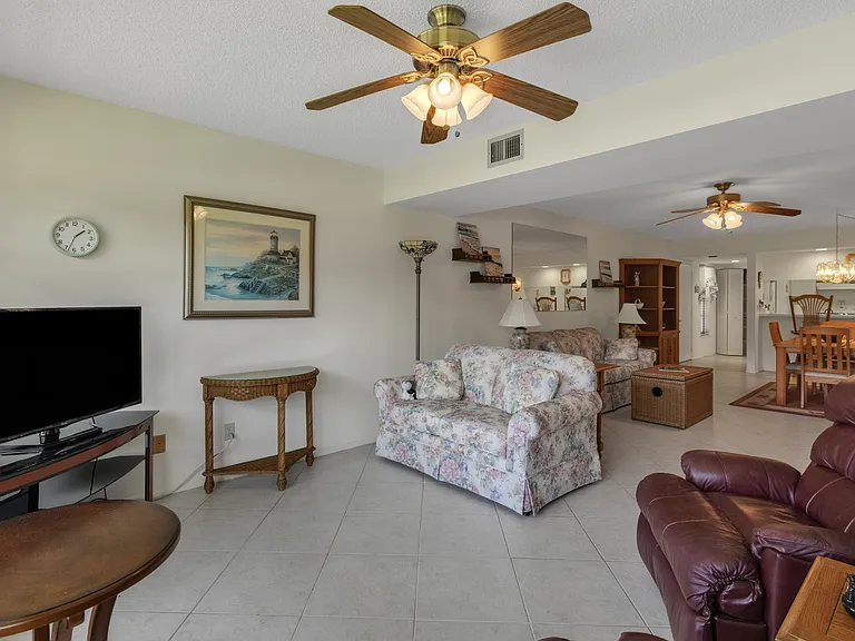 Living area to enjoy stunning lake & golf course views!