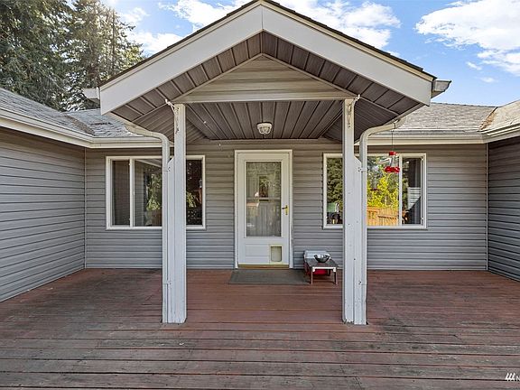 Spacious deck with door leading to living room.>