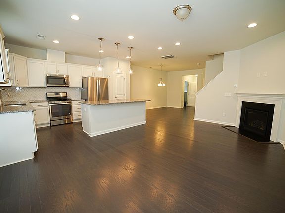 Family Room with Fireplace and Kitchen