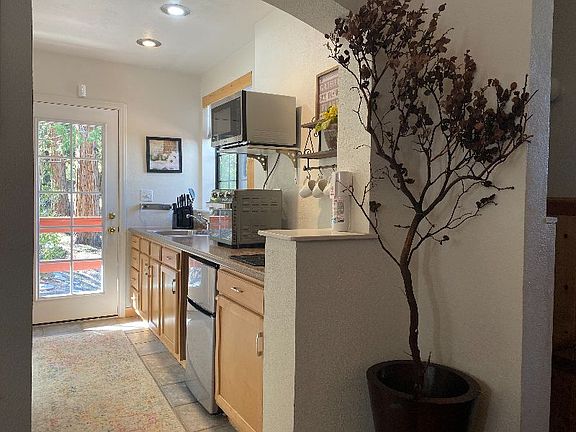 Kitchen: mini fridge, sink with garbage disposal and 2 burner induction cooktop.