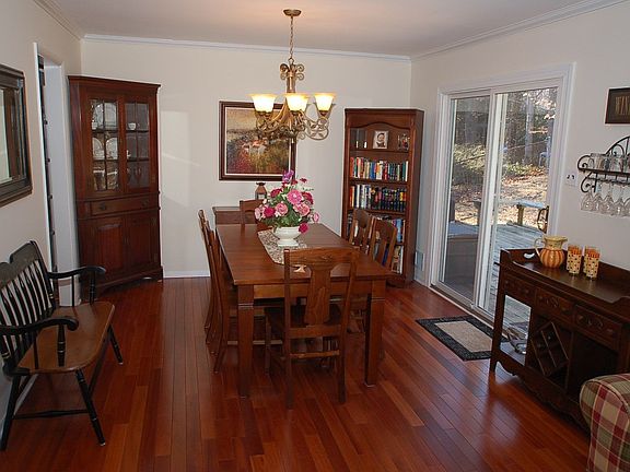 Formal Dining Room with Lyptus Hardwood Flooring, & sliding glass door to back