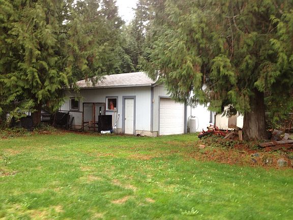 24 x 26' shop w/ cement slab, electricity & 2 bay doors