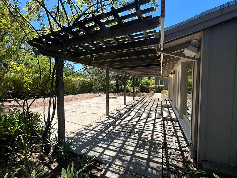 The tranquil stroll through the garden path to the rear patio