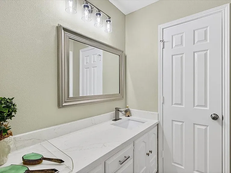 Dual vanity areas, New quartz countertops, sinks, hardware, mirrors and faucets.
