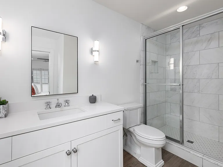 Full bathroom 2 is connected to bedroom 2 with a stand up shower.