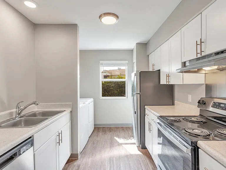 Experience open-concept living with seamless flow between the kitchen and living areas, professionally managed by Highlands Vista Group.